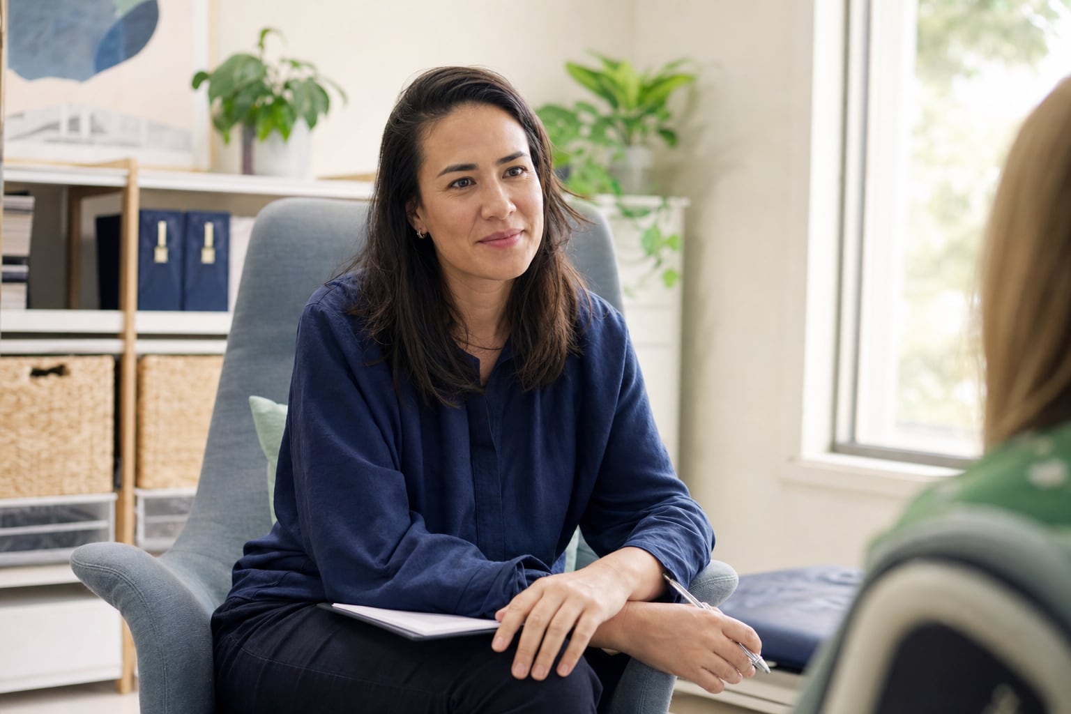 A practitioner listening during a private consultation